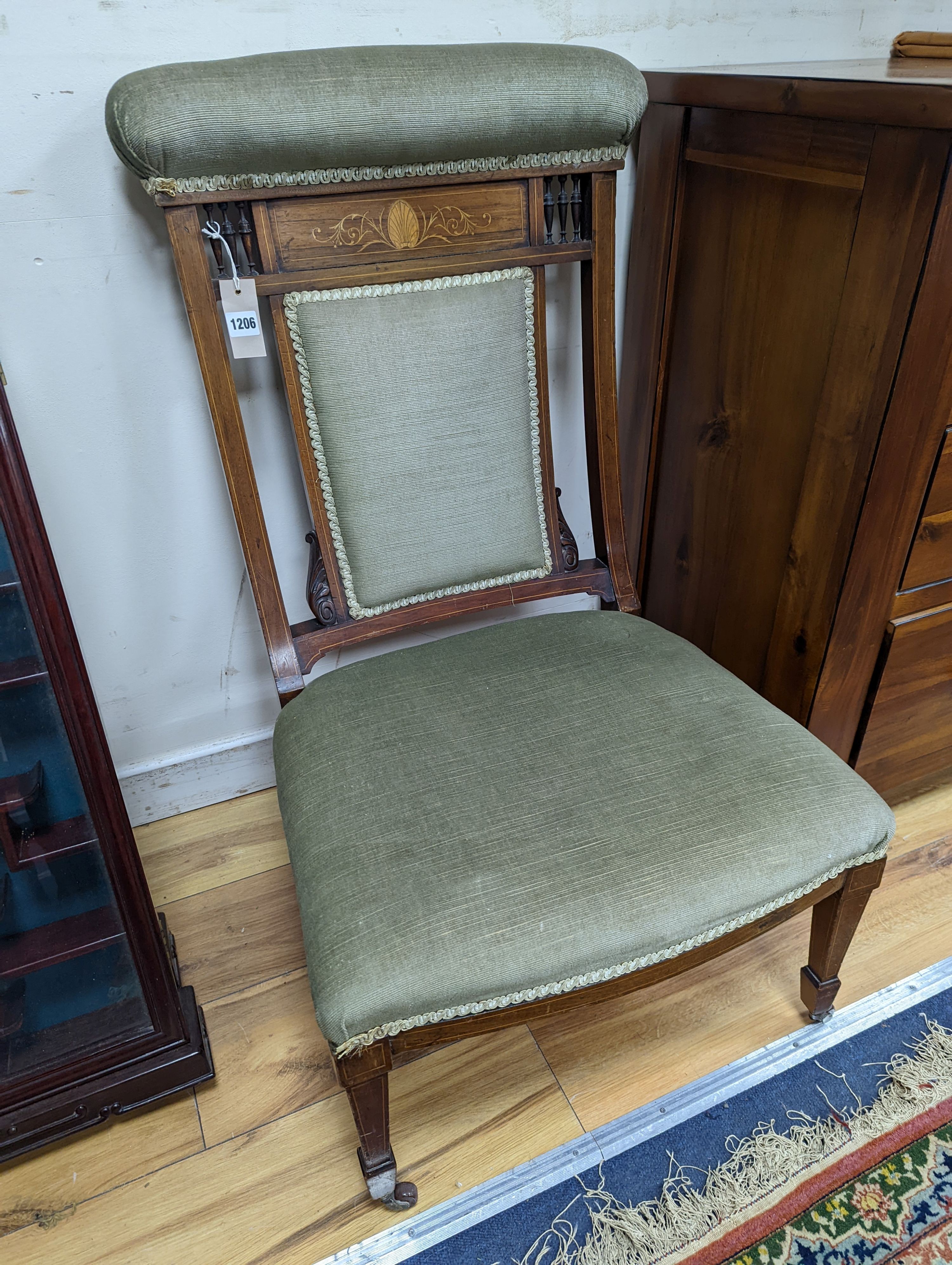 A late Victorian marquetry inlaid mahogany nursing chair